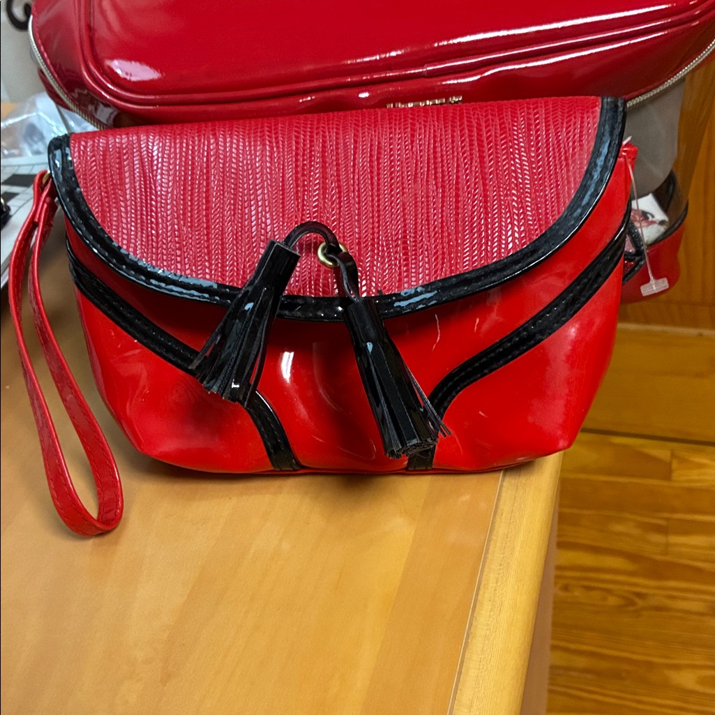 Elizabeth Arden Red And Black Tassel Clutch Elizabeth Arden Red And Black Tassel Clutch